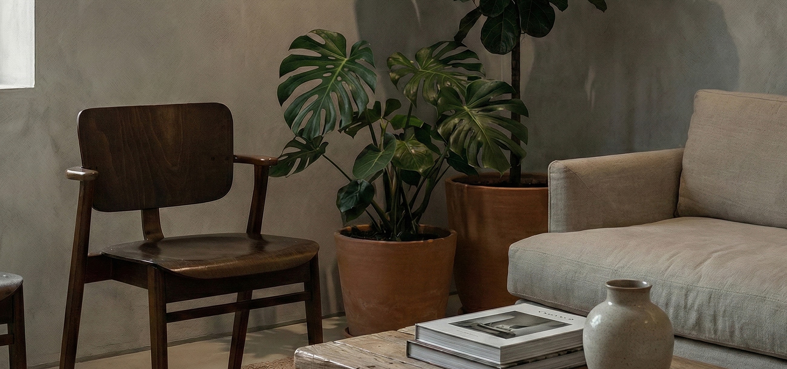 Cozy living room with plants and furniture.