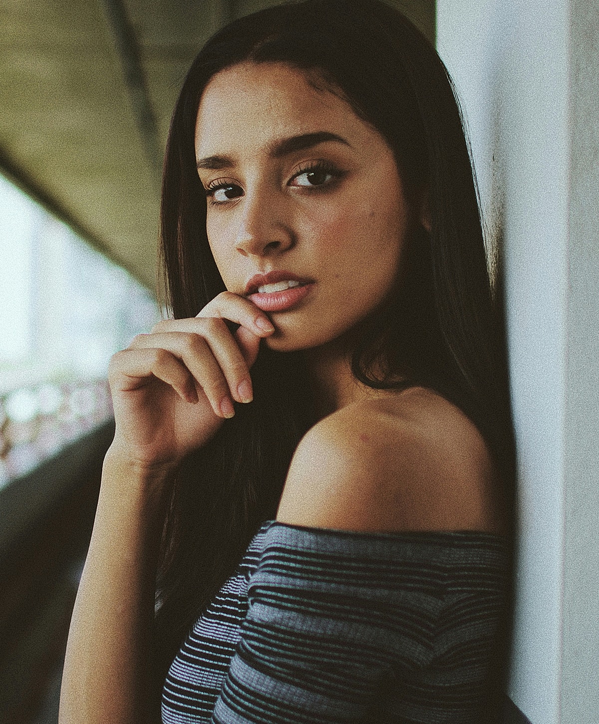 Portrait of a woman with long hair.
