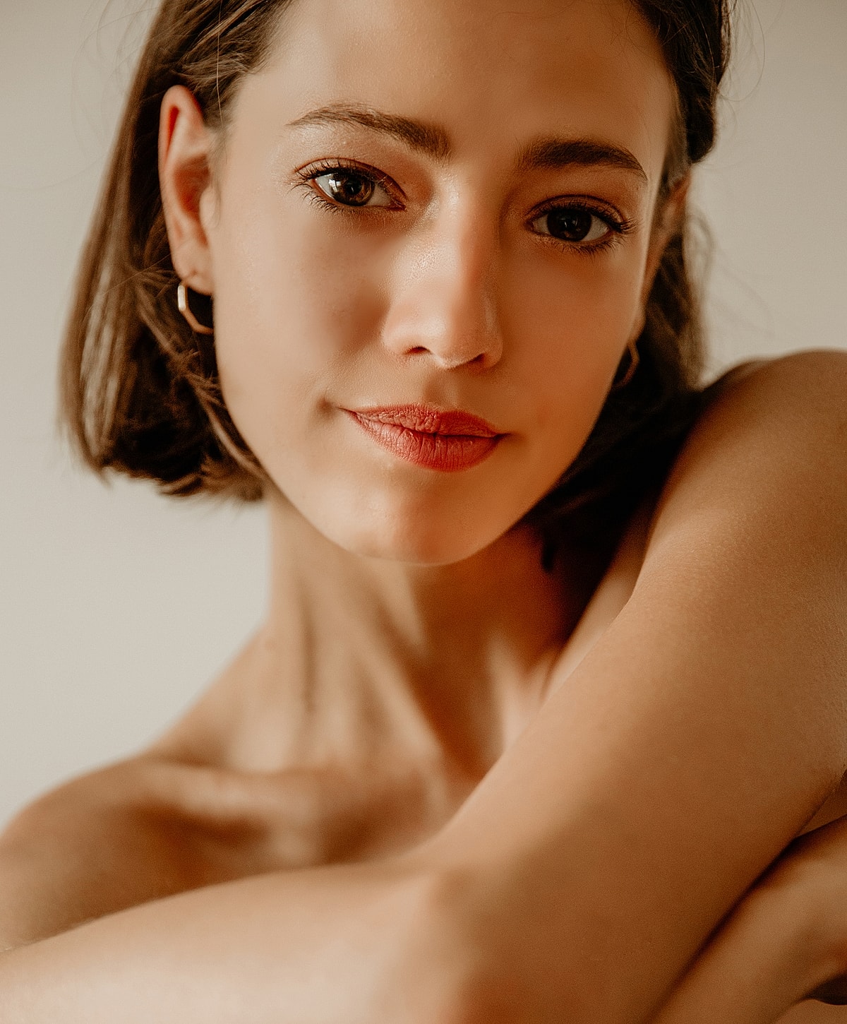 Close-up of a smiling woman with natural makeup.