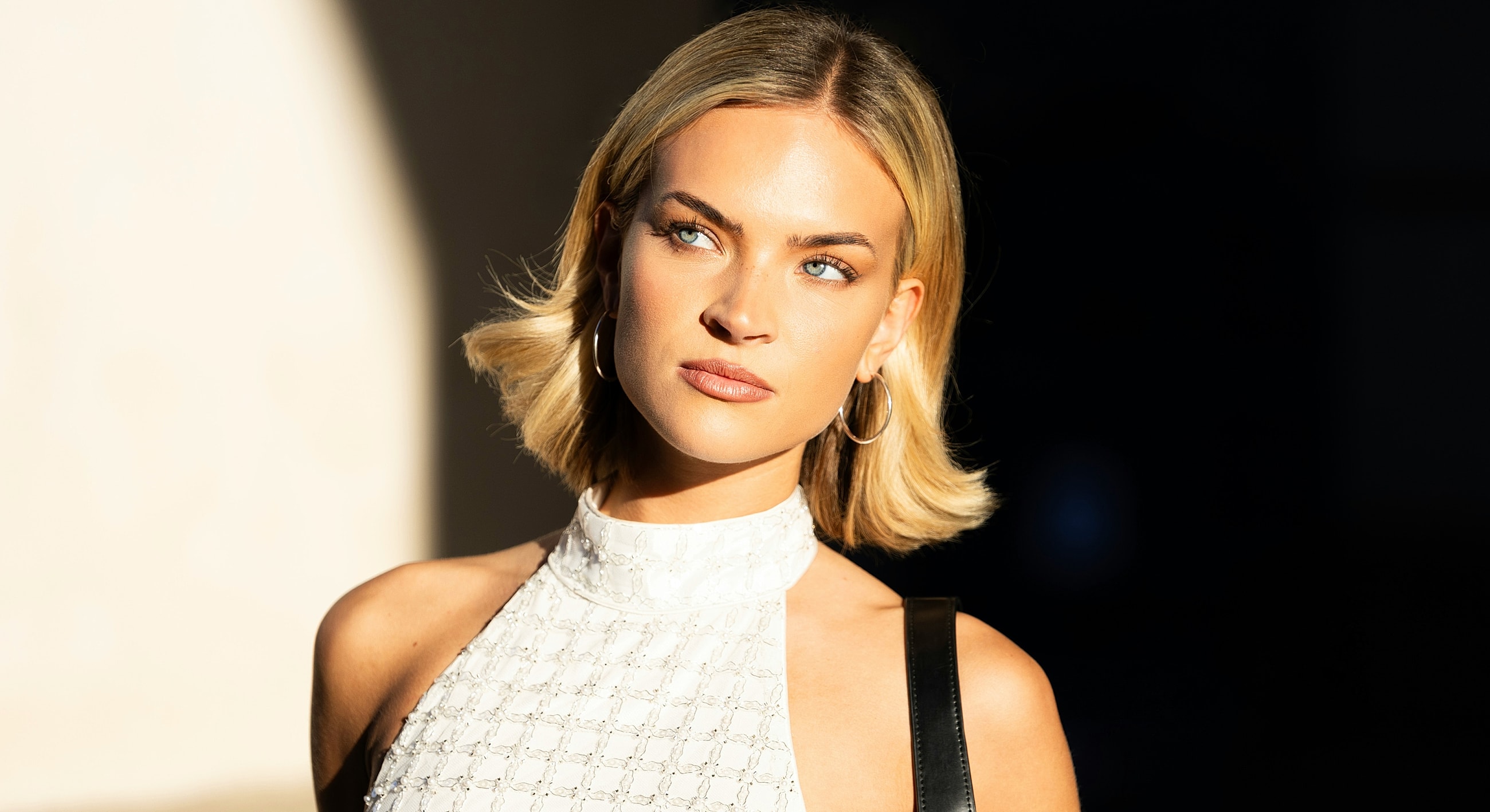 Woman with blonde hair in natural light.