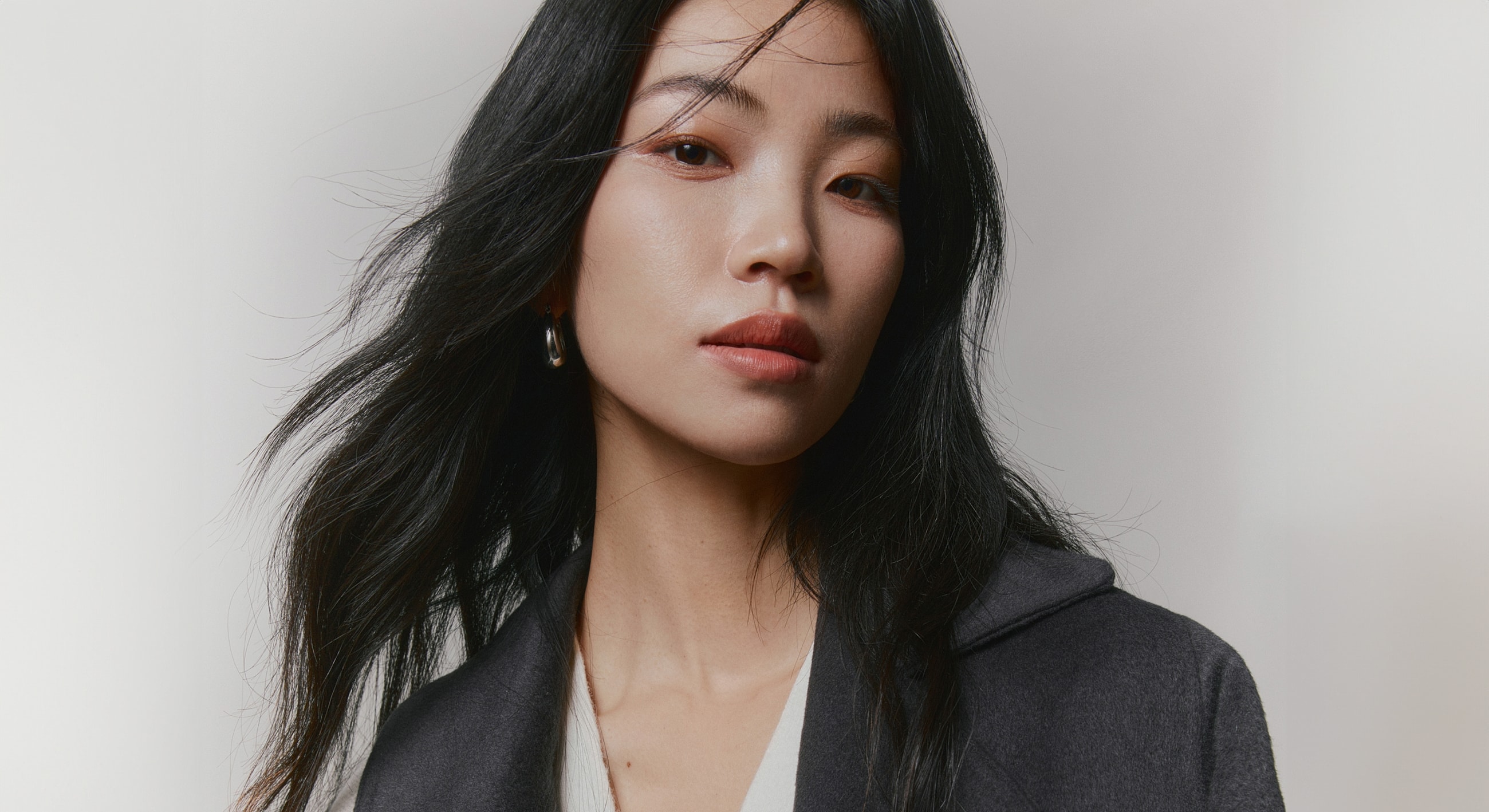 Portrait of a woman with long black hair.